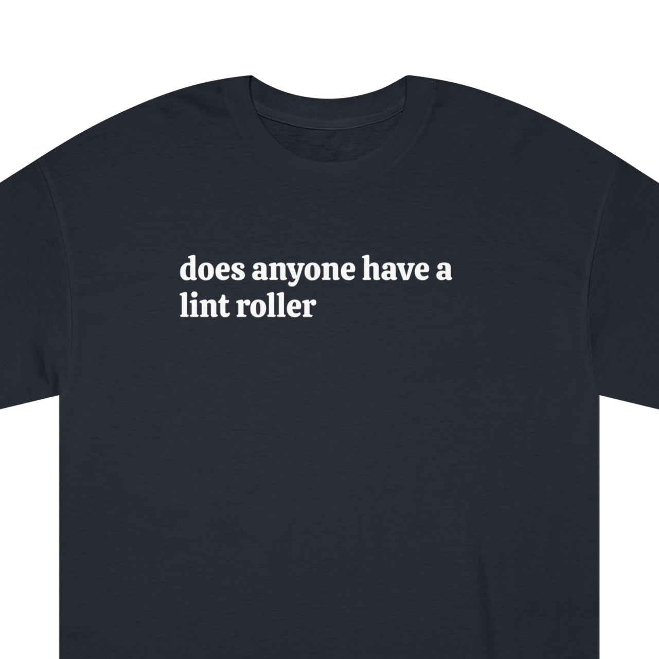 Zoomed in view of a black T-shirt with humorous phrase 'Does anyone have a lint roller' in white font.